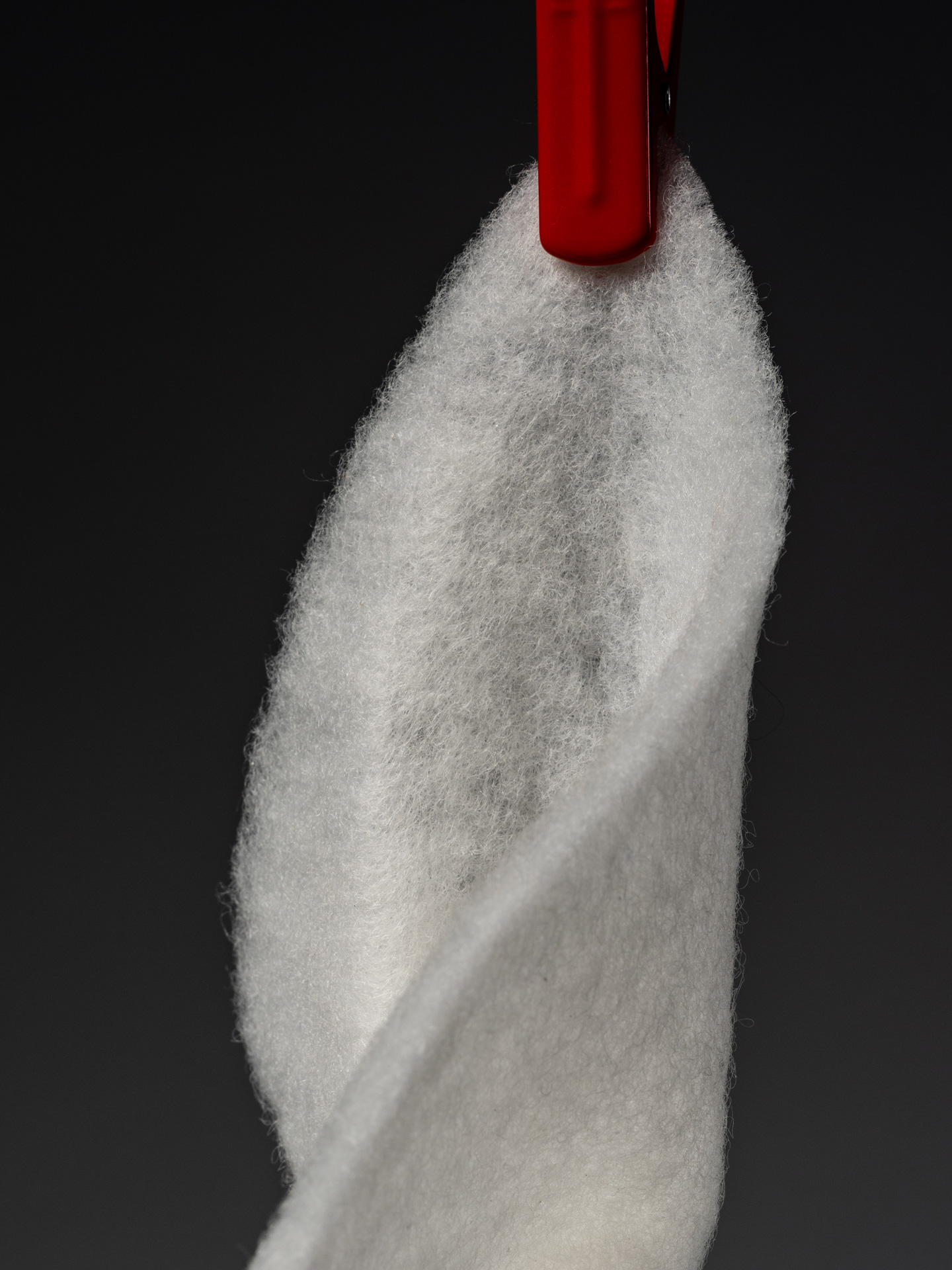 `PrimaLoft Utility insulation close-up showing soft synthetic fill texture