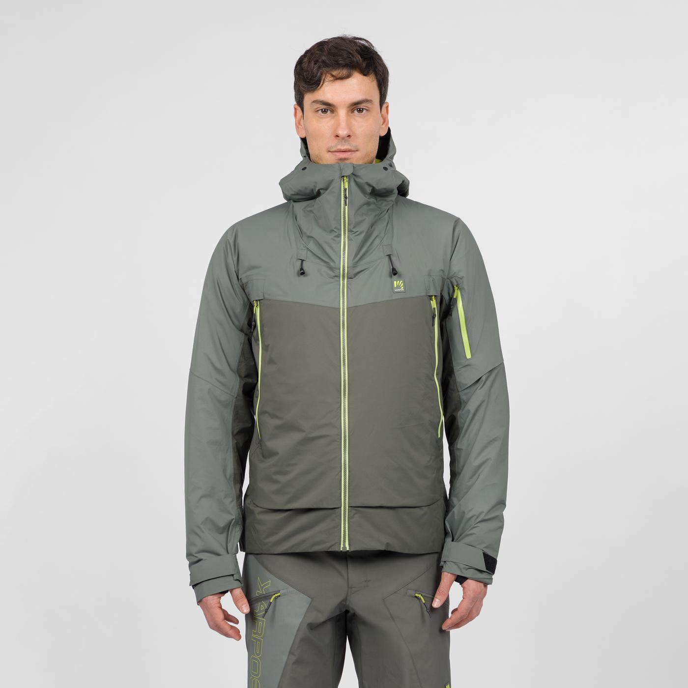 Man wearing an olive green hooded Karpos jacket with neon yellow zippers, front view