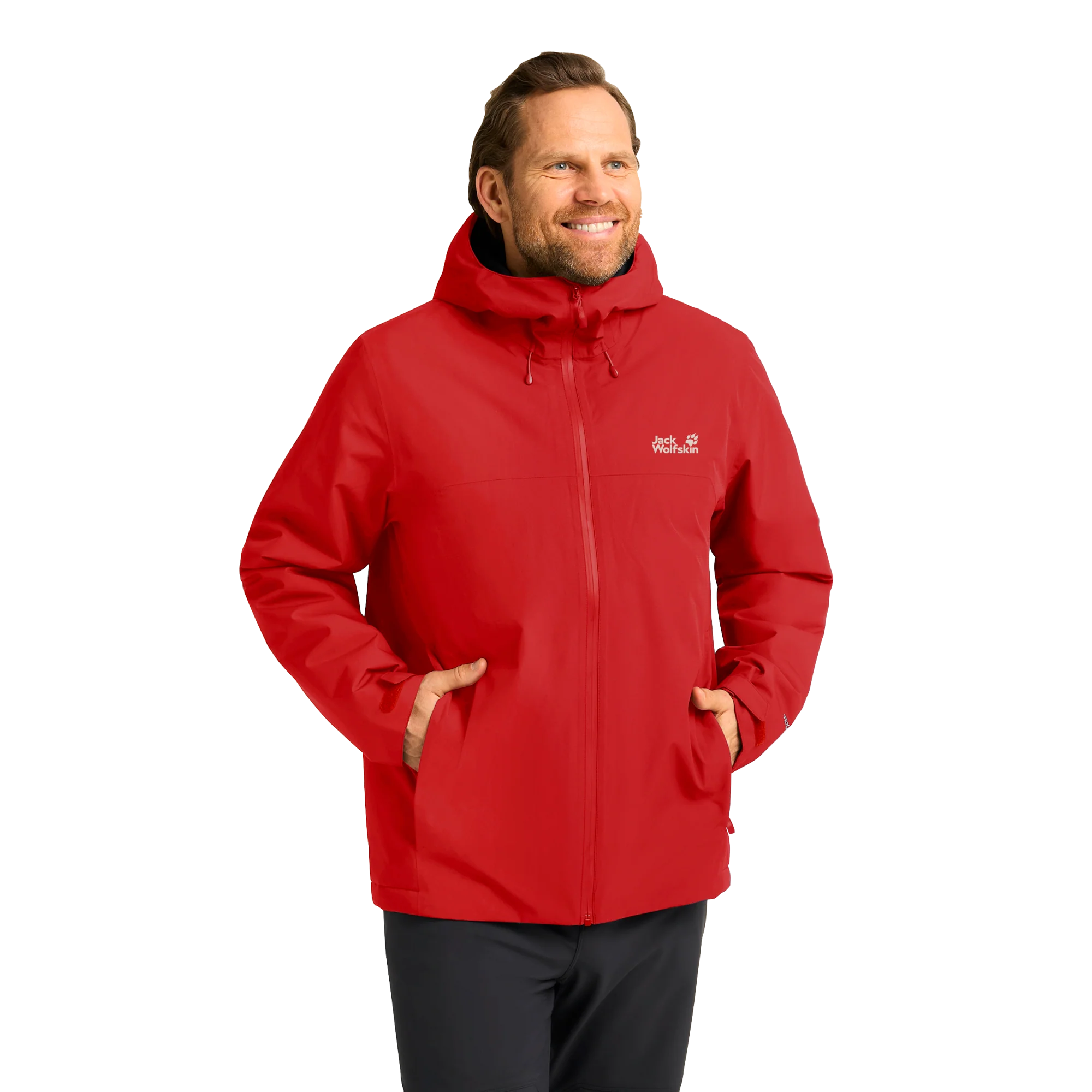 Smiling man wearing a red Jack Wolfskin hooded jacket with his hands in the pockets.