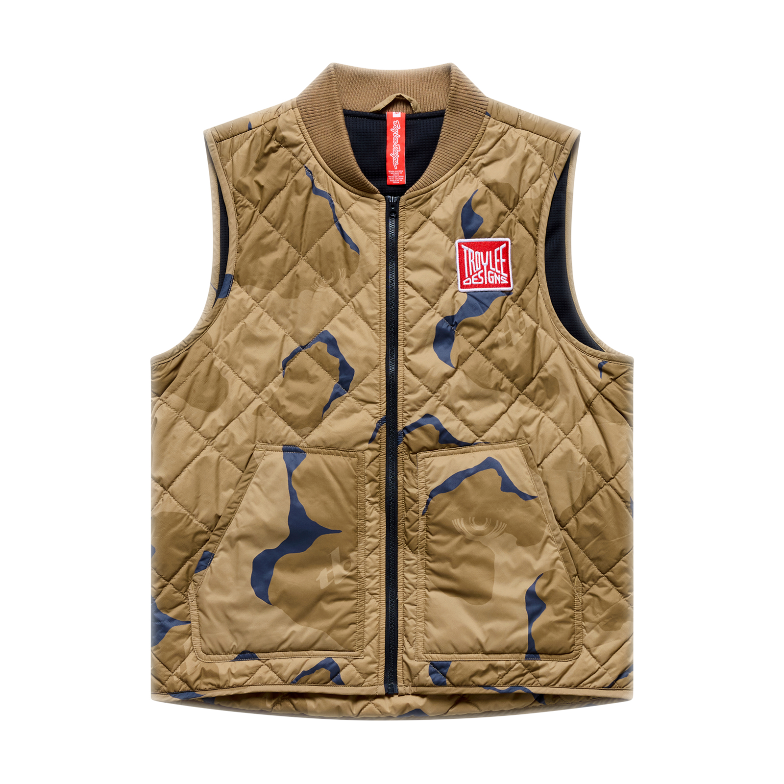 Tan camouflage quilted vest with a red logo patch, product shot.