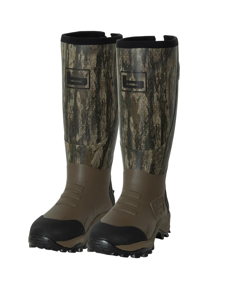 Pair of tall camouflage and brown waterproof rubber hunting boots with black soles, product shot.