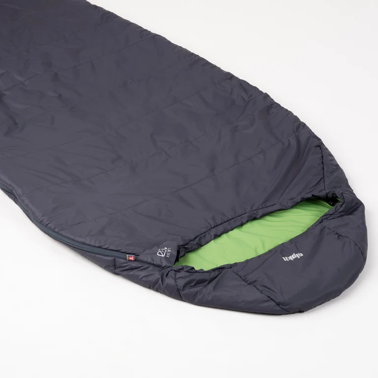 Close-up of a dark gray sleeping bag, showing a green interior lining and PrimaLoft logo tag.