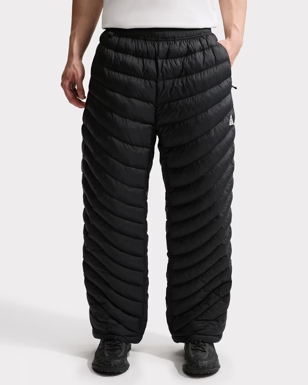 Black quilted pants, back view, product shot.